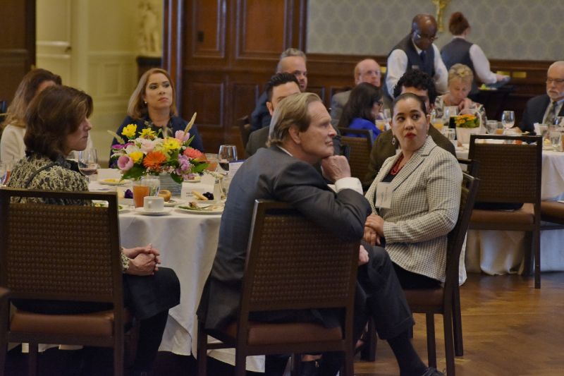 View of attendees seated at their dinner tables, listening to the speakers presentation during Pan American Day 2022.